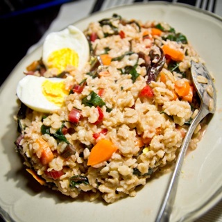 oat risotto style with kale, carrots, walnuts, and hardboiled egg
